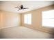 Large bedroom with neutral walls and large windows at 724 Redland Dr, Jonesboro, GA 30238