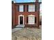 Charming brick townhouse with black shutters and a cozy front entrance at 724 Redland Dr, Jonesboro, GA 30238
