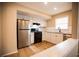 Well-lit kitchen featuring stainless steel appliances and white cabinets at 724 Redland Dr, Jonesboro, GA 30238