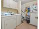 Laundry room with washer, dryer, and storage cabinets at 1480 Niskey Lake Sw Rd, Atlanta, GA 30331