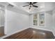 A spacious bedroom showcasing hardwood floors, trey ceiling, and a ceiling fan at 1934 Pinedale Pl, Decatur, GA 30032