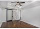 Main bedroom with dark hardwood floors and barn door at 1934 Pinedale Pl, Decatur, GA 30032