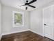 Bright bedroom with dark hardwood floors, ceiling fan, and white trim at 1934 Pinedale Pl, Decatur, GA 30032