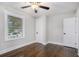 Bedroom has wood floors, fan and window at 1934 Pinedale Pl, Decatur, GA 30032