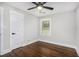 Bright bedroom with dark hardwood floors and ceiling fan at 1934 Pinedale Pl, Decatur, GA 30032