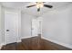 Bedroom with wood floors has ceiling fan and doors at 1934 Pinedale Pl, Decatur, GA 30032