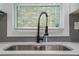 Modern kitchen sink with a black gooseneck faucet at 1934 Pinedale Pl, Decatur, GA 30032