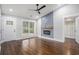 Bright living room with hardwood floors, modern fireplace, and a large window at 1934 Pinedale Pl, Decatur, GA 30032