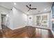 Spacious living room with hardwood floors, modern fireplace feature wall, and natural light at 1934 Pinedale Pl, Decatur, GA 30032