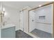 Bathroom with a walk-in shower and barn door at 369 Antioch Rd, Dallas, GA 30157