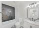 Bathroom featuring black and white tile design, bathtub and shower combo, and granite countertop at 369 Antioch Rd, Dallas, GA 30157