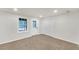 Bright bedroom with neutral walls, carpet, a window, exterior door, and closet at 369 Antioch Rd, Dallas, GA 30157