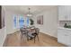 Bright dining room features a wood table, four chairs, and a bay window at 369 Antioch Rd, Dallas, GA 30157