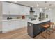 Modern kitchen with white shaker cabinets, quartz countertops, and a kitchen island at 369 Antioch Rd, Dallas, GA 30157