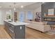 Modern kitchen island with white cabinets and quartz countertops at 369 Antioch Rd, Dallas, GA 30157