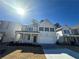 Two-story house with white siding, gray shutters, and a two-car garage at 799 River Gardens Se Dr, Atlanta, GA 30354