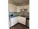 White cabinets, granite countertops, and a corner sink in this kitchen at 809 Jordan Ln # K3, Decatur, GA 30033