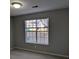 Bright bedroom with large window and neutral wall paint at 2331 Rambling Way, Lithonia, GA 30058