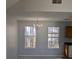 Bright dining room with chandelier and large windows at 2331 Rambling Way, Lithonia, GA 30058