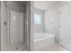 Bathroom with shower, bathtub, and window at 3178 Cedar Crest Way, Decatur, GA 30034