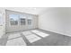 Well lit bedroom with grey carpet and multiple windows at 3178 Cedar Crest Way, Decatur, GA 30034