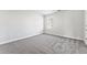 Simple bedroom with grey carpet and a window at 3178 Cedar Crest Way, Decatur, GA 30034