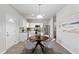 Kitchen dining area with four-chair table and modern light fixture at 3178 Cedar Crest Way, Decatur, GA 30034