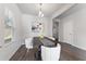 Modern dining room with dark wood table and white chairs at 3178 Cedar Crest Way, Decatur, GA 30034