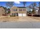 Two-story brick house with a two car garage and landscaping at 3178 Cedar Crest Way, Decatur, GA 30034