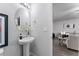 Modern powder room with pedestal sink and view into living area at 3178 Cedar Crest Way, Decatur, GA 30034