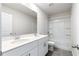 Bathroom with double vanity, tub, and grey tile floors at 4839 Dufour Dr, Lilburn, GA 30047