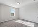 Bright bedroom featuring grey carpeting and a window with blinds at 4839 Dufour Dr, Lilburn, GA 30047