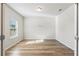 Bright and airy bedroom with light walls and wood-look flooring at 4839 Dufour Dr, Lilburn, GA 30047