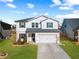 Two-story house with white siding and blue shutters at 4839 Dufour Dr, Lilburn, GA 30047