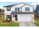 Two-story house with white siding and blue shutters at 4839 Dufour Dr, Lilburn, GA 30047