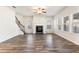 Bright living room with hardwood floors, fireplace, and ceiling fan at 4839 Dufour Dr, Lilburn, GA 30047