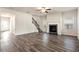 Bright living room with hardwood floors, fireplace, and ceiling fan at 4839 Dufour Dr, Lilburn, GA 30047