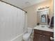 Clean bathroom with dark vanity and shower/tub combo at 5514 Park S Pl, Atlanta, GA 30349