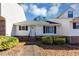 White exterior of house with landscaping and walkway at 5514 Park S Pl, Atlanta, GA 30349