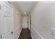 Bright hallway with dark hardwood floors and neutral walls at 5514 Park S Pl, Atlanta, GA 30349