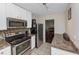 Kitchen with stainless steel appliances and granite countertops at 5514 Park S Pl, Atlanta, GA 30349