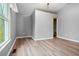 Bedroom with hardwood floors and a large window at 23 Faith Ct, Douglasville, GA 30134