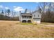 Gray house with white trim, two-car garage, and a deck at 23 Faith Ct, Douglasville, GA 30134