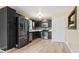 Kitchen with dark cabinets and stainless steel appliances at 23 Faith Ct, Douglasville, GA 30134