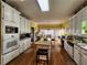 Spacious kitchen with white cabinets, granite countertops, and stainless steel appliances at 2509 Fairweather Ct, Conyers, GA 30013