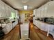 Bright eat-in kitchen with an island, stainless steel appliances, and hardwood floors at 2509 Fairweather Ct, Conyers, GA 30013