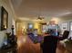 Spacious living room features a fireplace, hardwood floors, ceiling fan, and comfortable seating at 2509 Fairweather Ct, Conyers, GA 30013