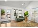 Open living space with hardwood floors and access to a deck at 2049 Meador Se Ave, Atlanta, GA 30315