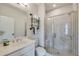 Modern bathroom with marble shower, bench, and floating shelves at 2651 Stream Nw Ter, Atlanta, GA 30318