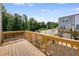 Private deck overlooking trees and a residential street at 2651 Stream Nw Ter, Atlanta, GA 30318